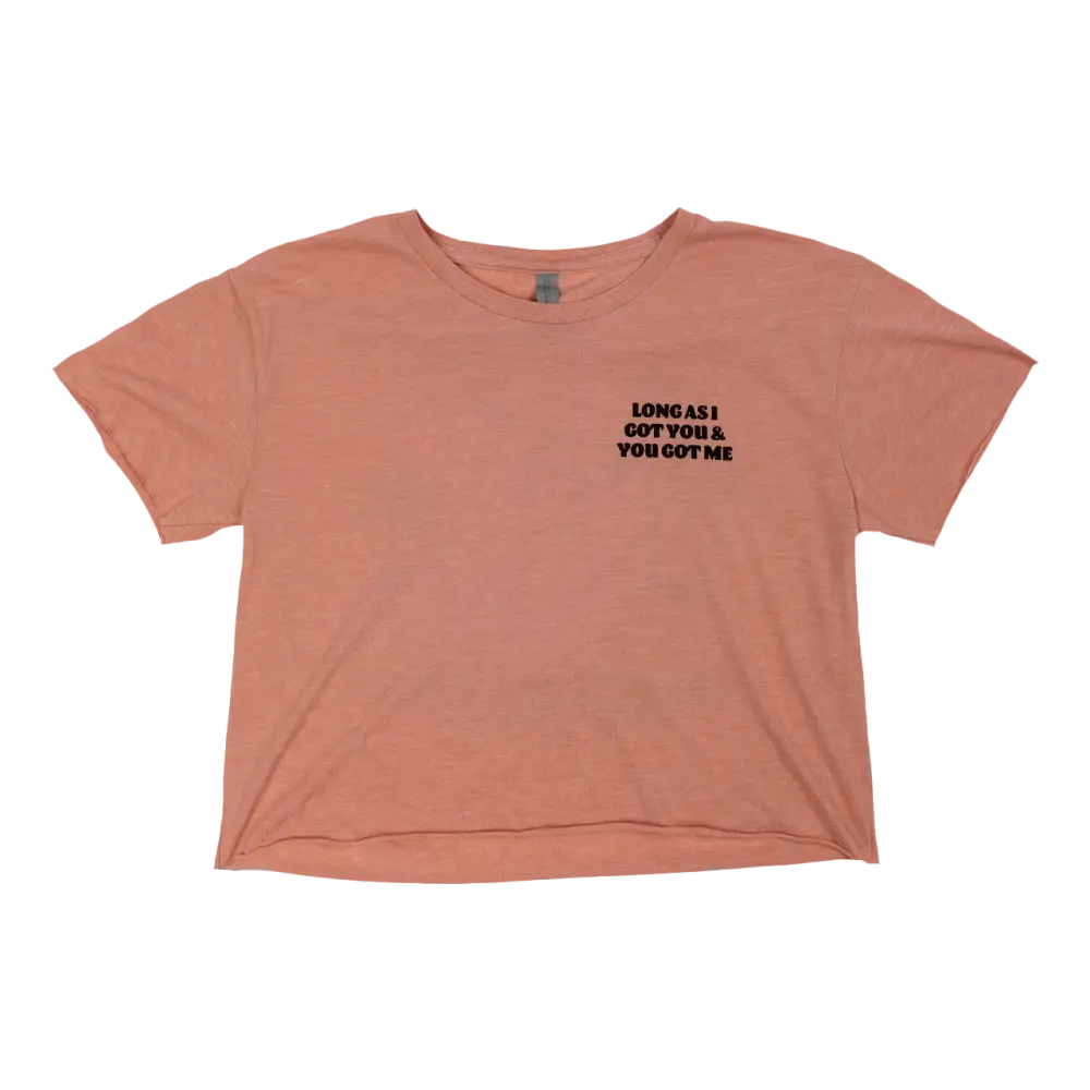 Peach-colored cropped t-shirt with black text on the left chest area.