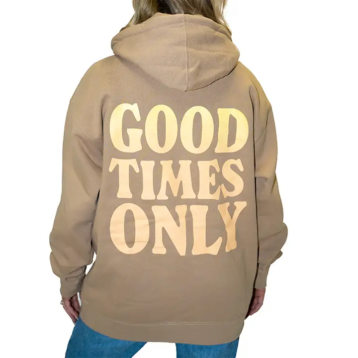 Tan hoodie with ’GOOD TIMES ONLY’ printed on the back in large letters.