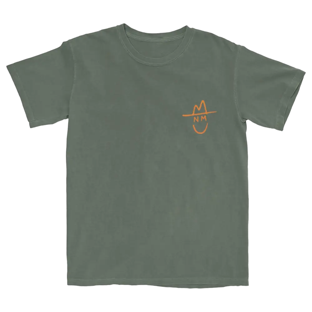 Green t-shirt with a small orange smiley face design on the chest.