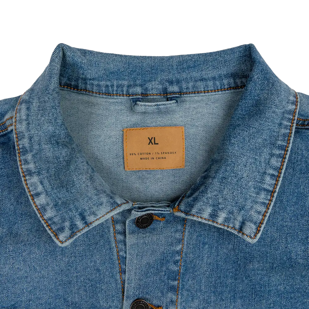 Denim jacket collar with an XL size tag visible.