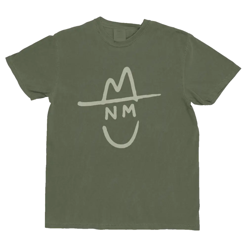 Olive green cotton t-shirt featuring a white stylized graphic of a smiling face wearing a hat with ’nm’ initials.