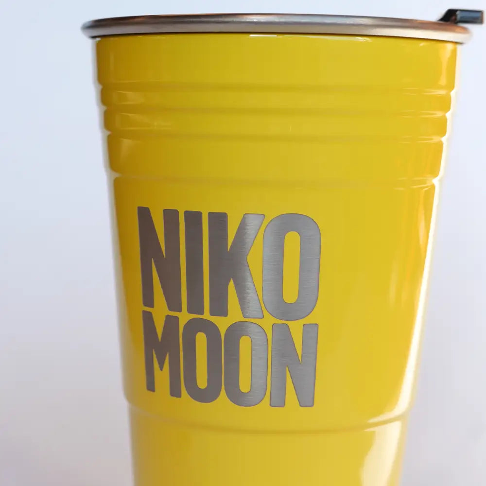 Yellow cup with silver trim.