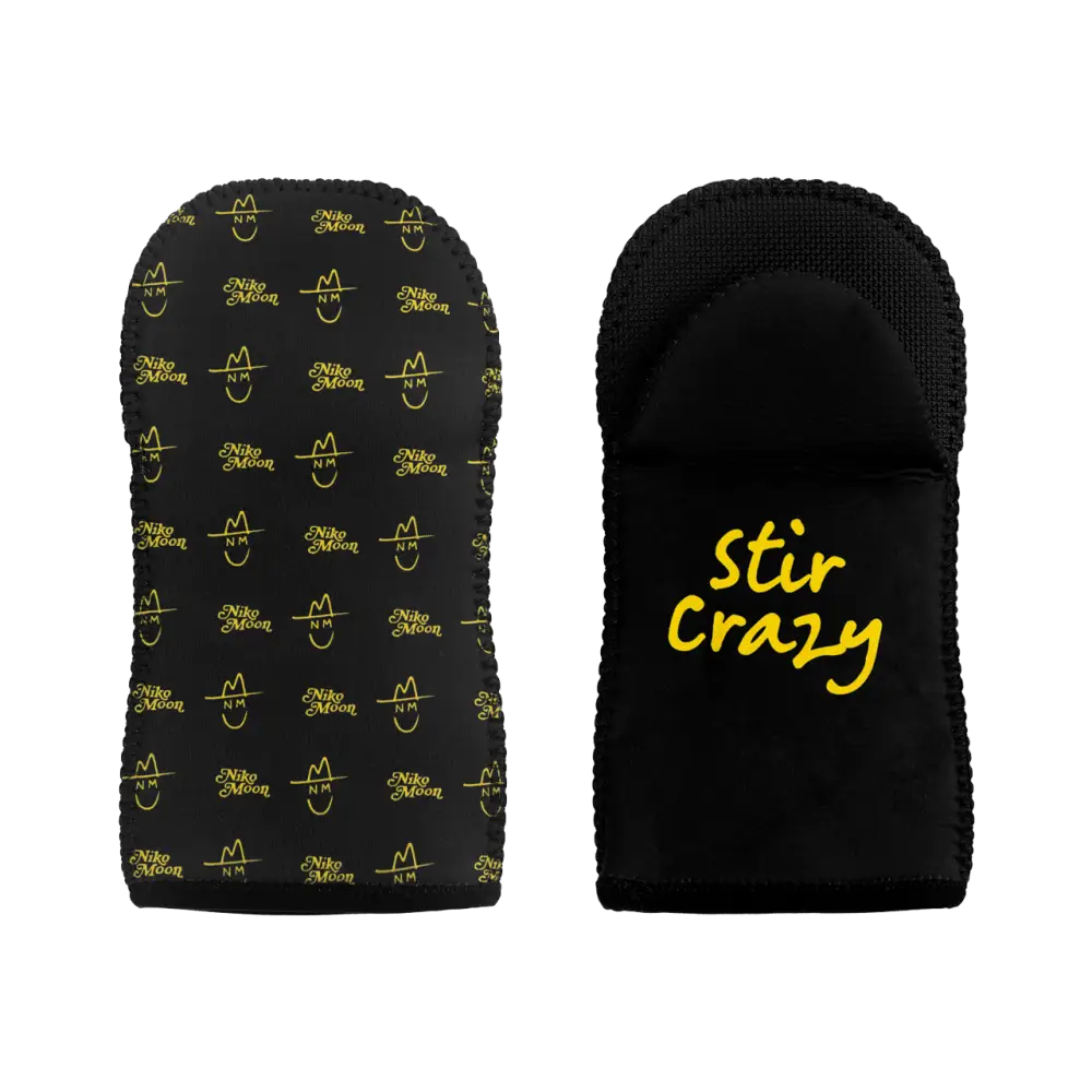 Pair of black oven mitts with yellow ’Stir Crazy’ text and pattern.