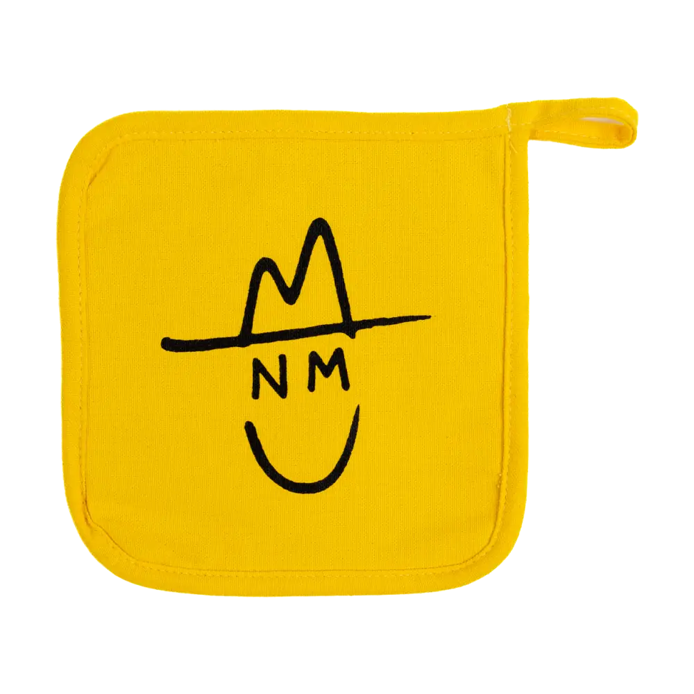 Yellow pot holder with a simple black line drawing of a smiling face wearing a hat.