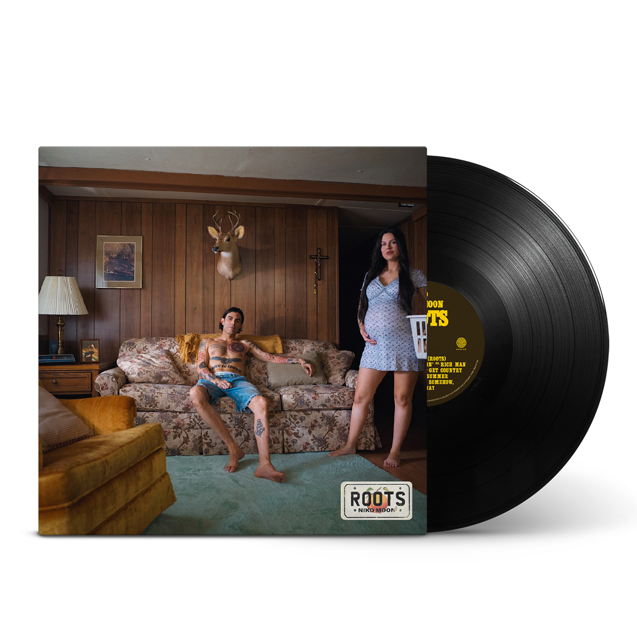 Vinyl record with a cover featuring a couple in a room, and the record itself on a white background.