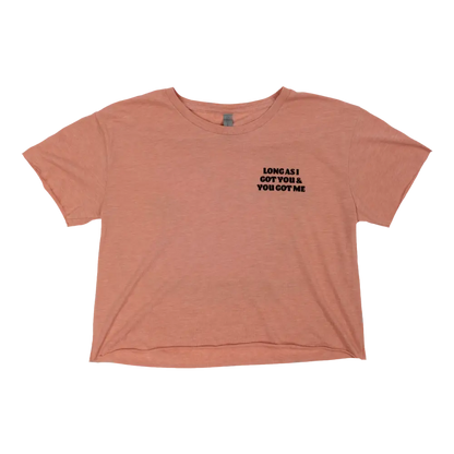 Peach-colored cropped t-shirt with black text on the left chest area.
