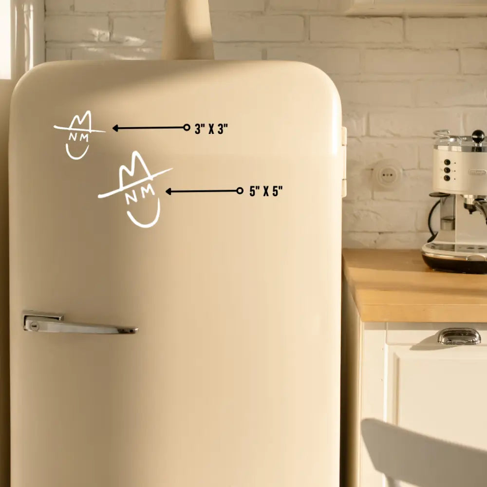 Retro-style cream-colored refrigerator with hand-drawn smiley faces and measurements on its door.