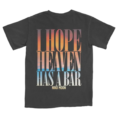Black t-shirt with colorful text reading ’I HOPE HEAVEN HAS A BAR NIKO MOON’.