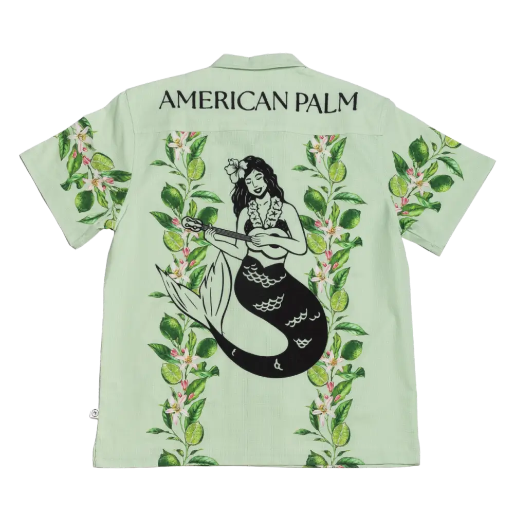 Light green american palm hawaiian shirt featuring a black mermaid playing a ukulele surrounded by tropical foliage.